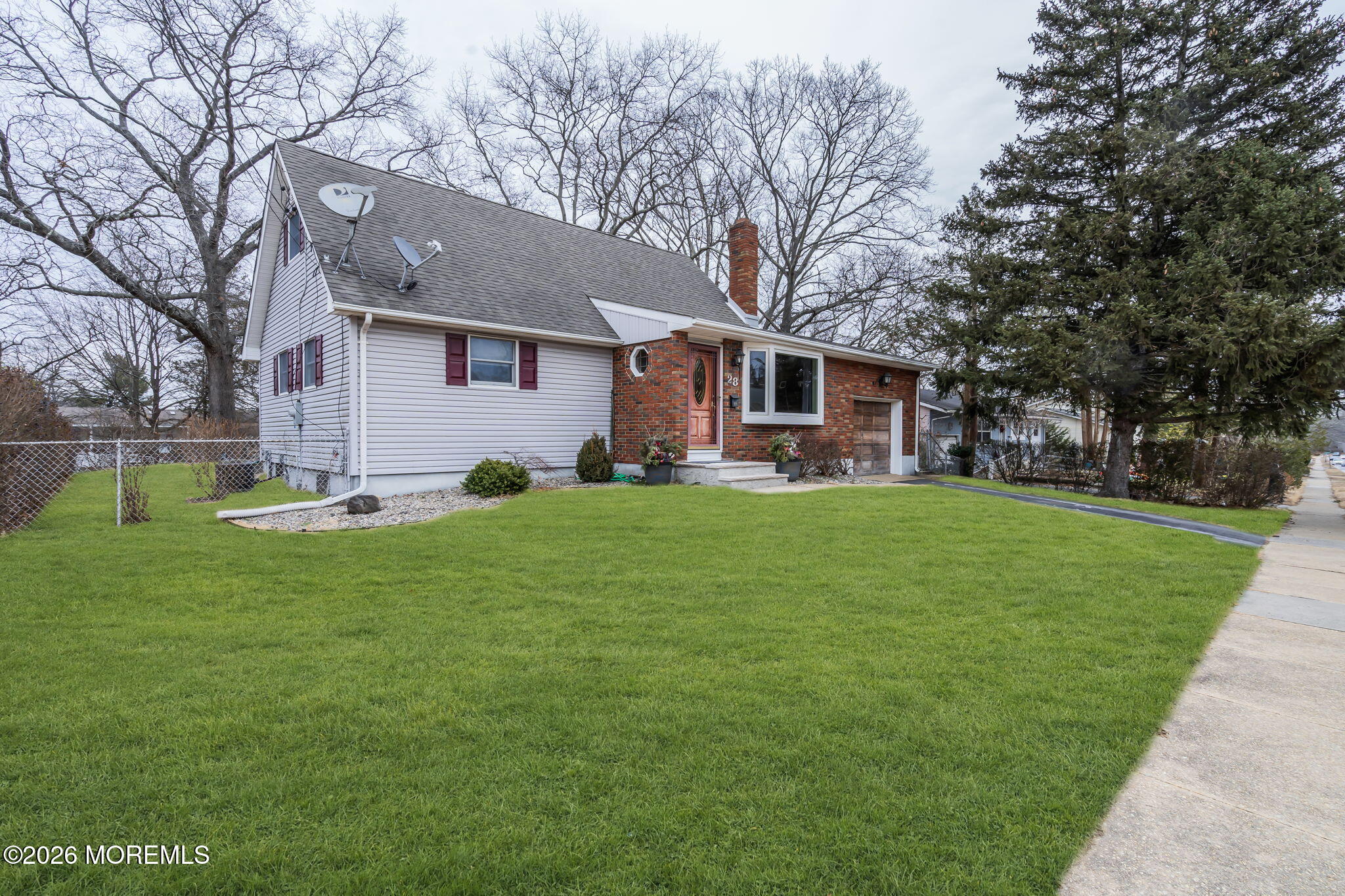 28 Oregon Avenue Jackson, NJ 08527 - Photo 3 of 33 a front view of house with yard and green space