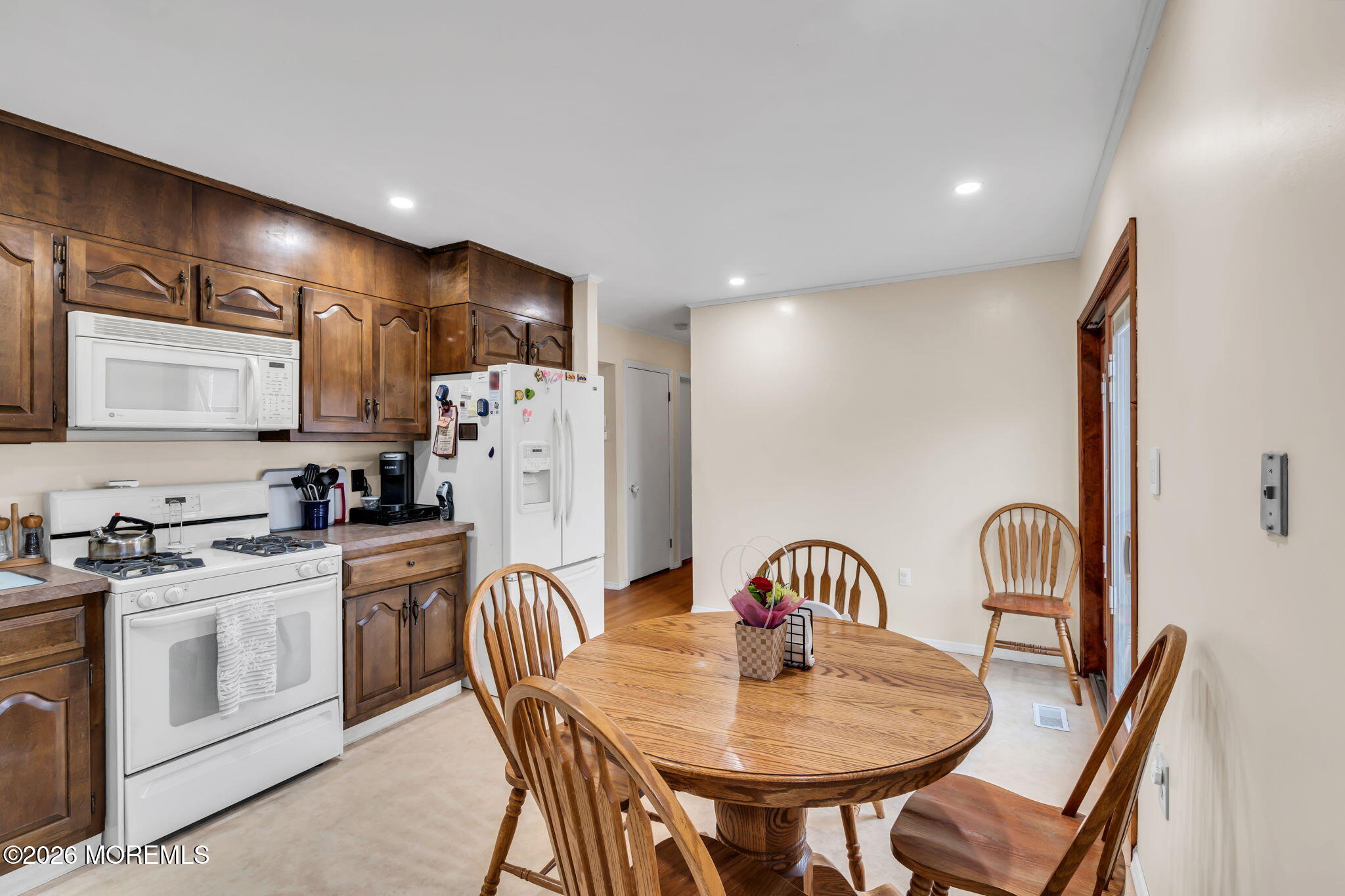 28 Oregon Avenue Jackson, NJ 08527 - Photo 10 of 33 a kitchen with stainless steel appliances granite countertop a dining table and chairs