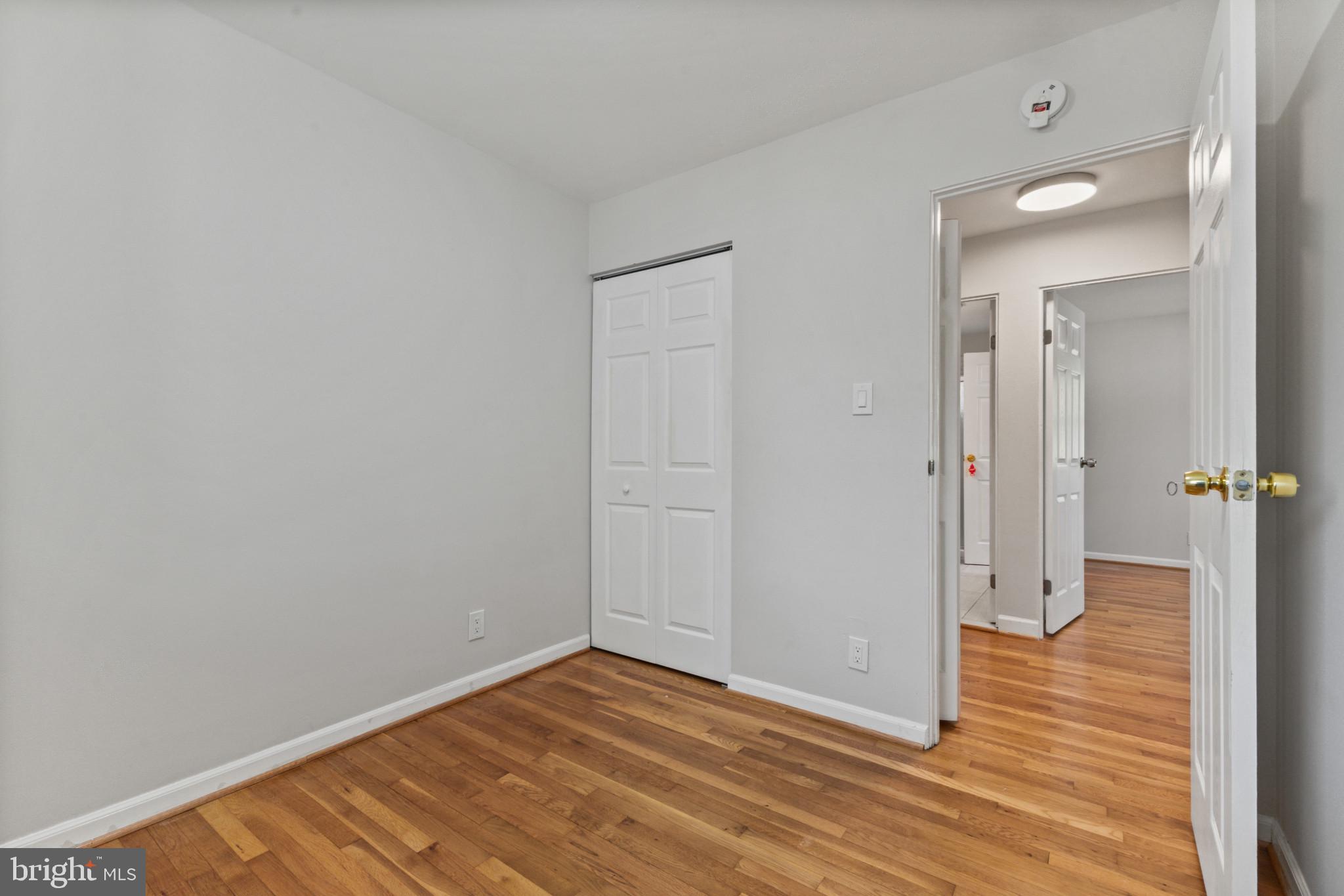 403 West Poplar Road Sterling, VA 20164 - Photo 13 of 25 Bright and airy room with hardwood floors.