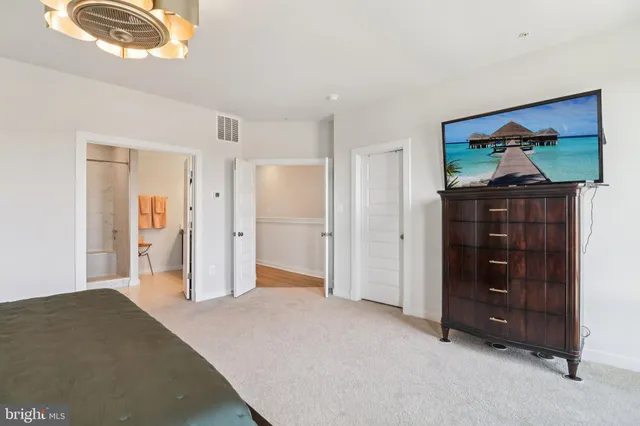 a bathroom with a shower sink and mirror