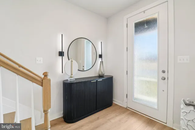 a room with view of a bathroom and mirror