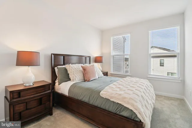 a bedroom with a bed and a mirror