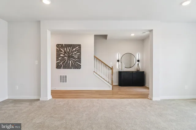 a bedroom with a bed and a lamp on table