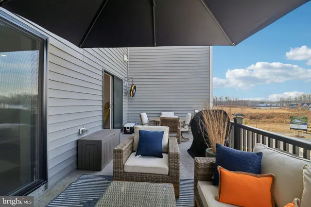 a view of a brick house with potted plants