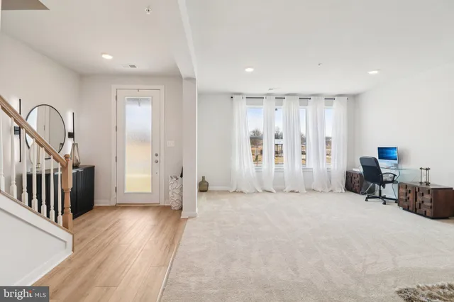 a bathroom with a sink a window and a mirror