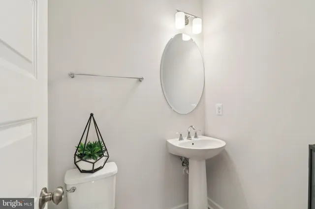 a kitchen with stainless steel appliances granite countertop a stove and a large refrigerator