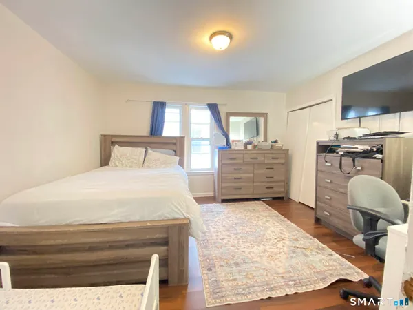 a bedroom with a bed and furniture