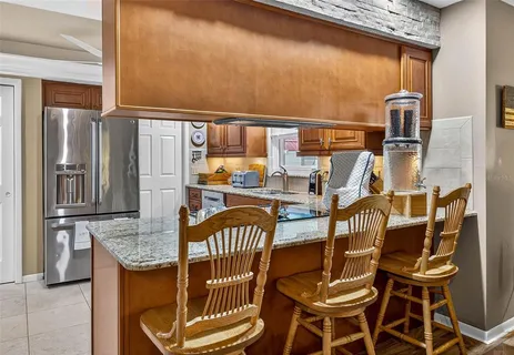 a view of a balcony dining area with furniture