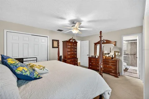 a bedroom with a bed and a dresser