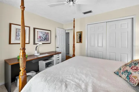 a bathroom with a sink a toilet and shower curtain