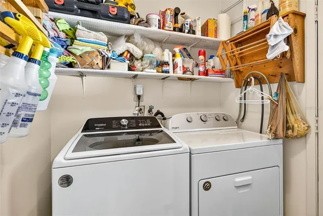 a living room with furniture a rug and a large window