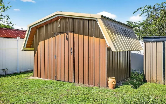 a front view of a house with outdoor seating