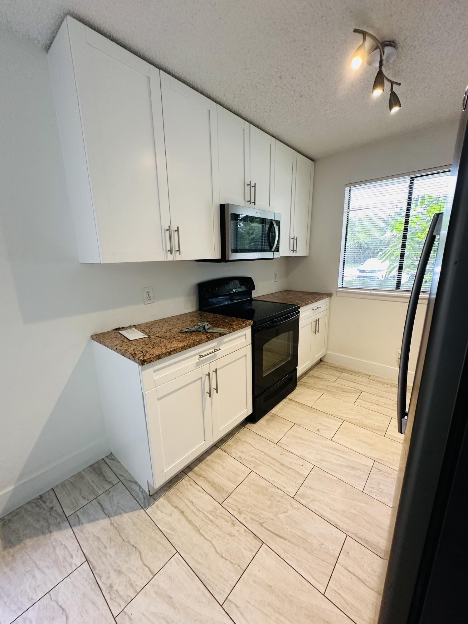 300 Nottingham Circle, Unit E Greenacres, FL 33463 - Photo 3 of 10 IMG_0459