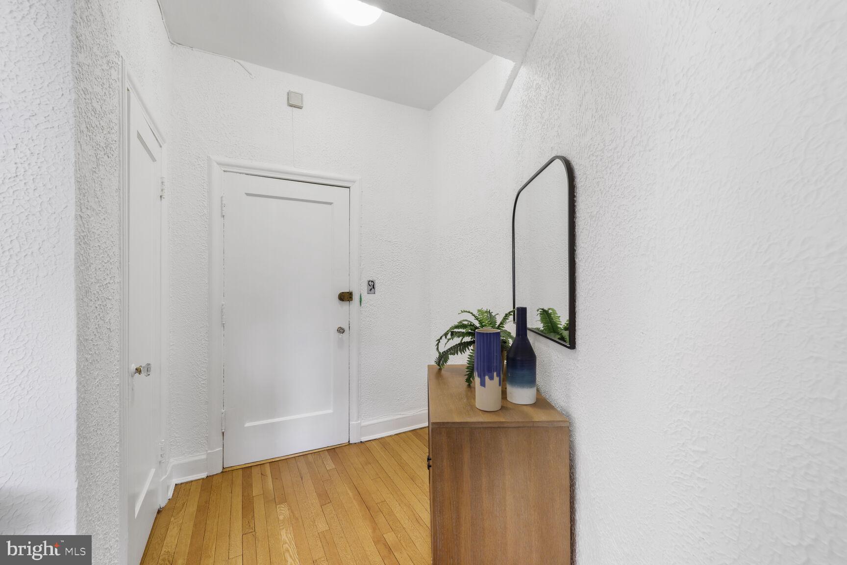 2032 Belmont Road Northwest, Unit 336 Washington, DC 20009 - Photo 21 of 23 a view of a room with a potted plant