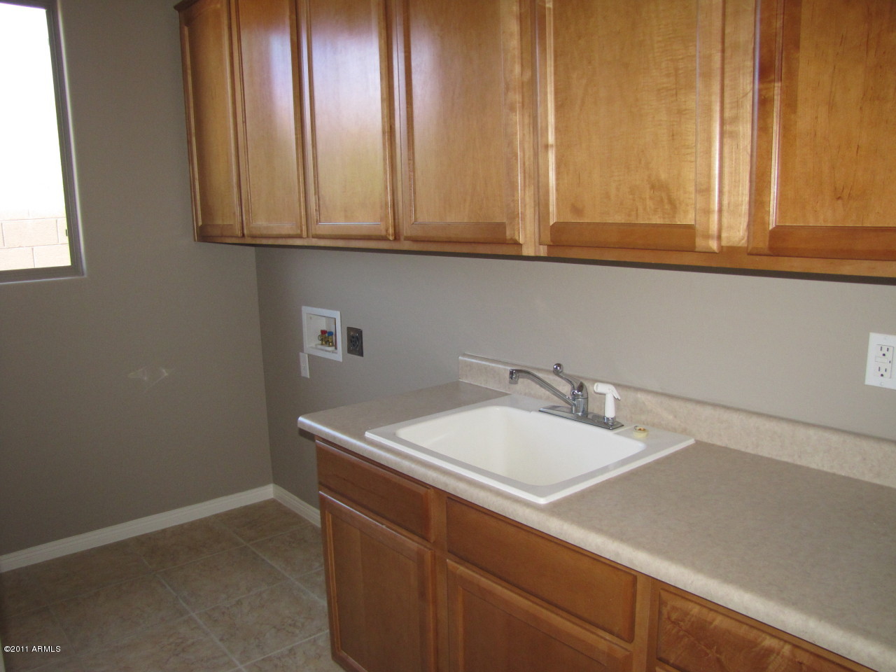 1815 West Brianna Road Phoenix, AZ 85085 - Photo 16 of 20 laundry room with cabinets