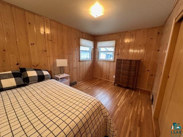 62 Elm Boulevard Babbitt, MN 55706 - Photo 11 of 21 Unfurnished bedroom with wooden walls and wood finished floors