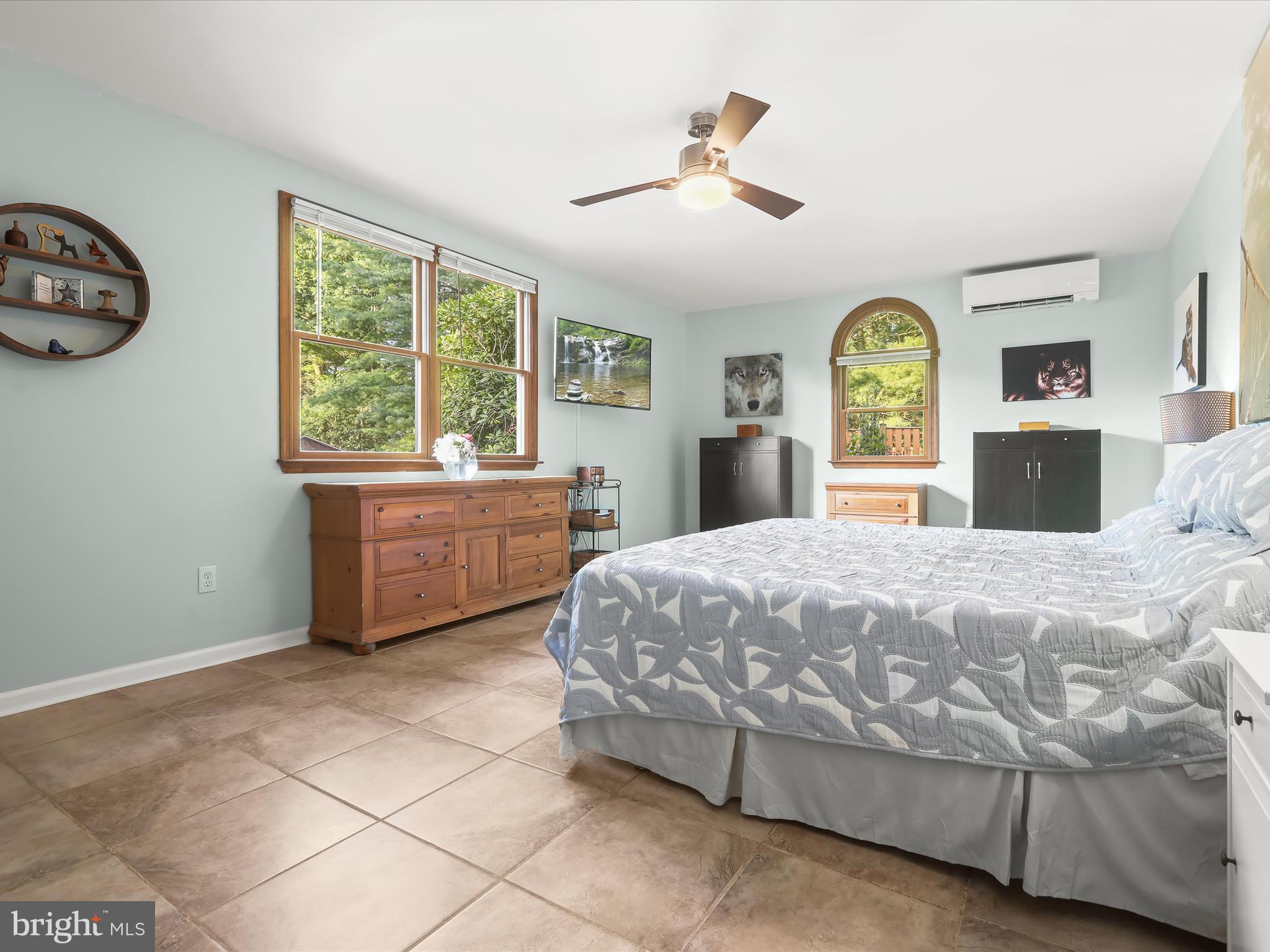 5129 Grave Run Road Manchester, MD 21102 - Photo 27 of 60 a bedroom with a bed and a chandelier