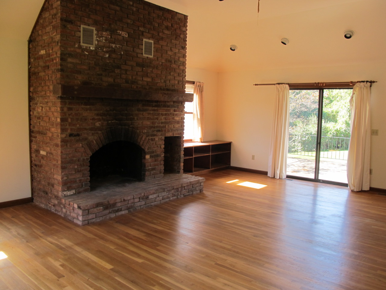 127 Middle Ridge Road New Canaan, CT 06840 - Photo 4 of 9 a view of empty room with wooden floor and fireplace
