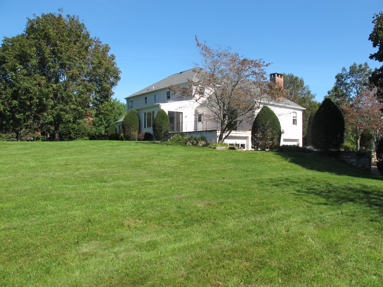 127 Middle Ridge Road New Canaan, CT 06840 - Photo 5 of 9 a view of a house with a big yard