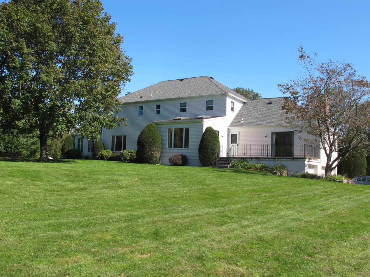 127 Middle Ridge Road New Canaan, CT 06840 - Photo 6 of 9 a view of a house with a back yard