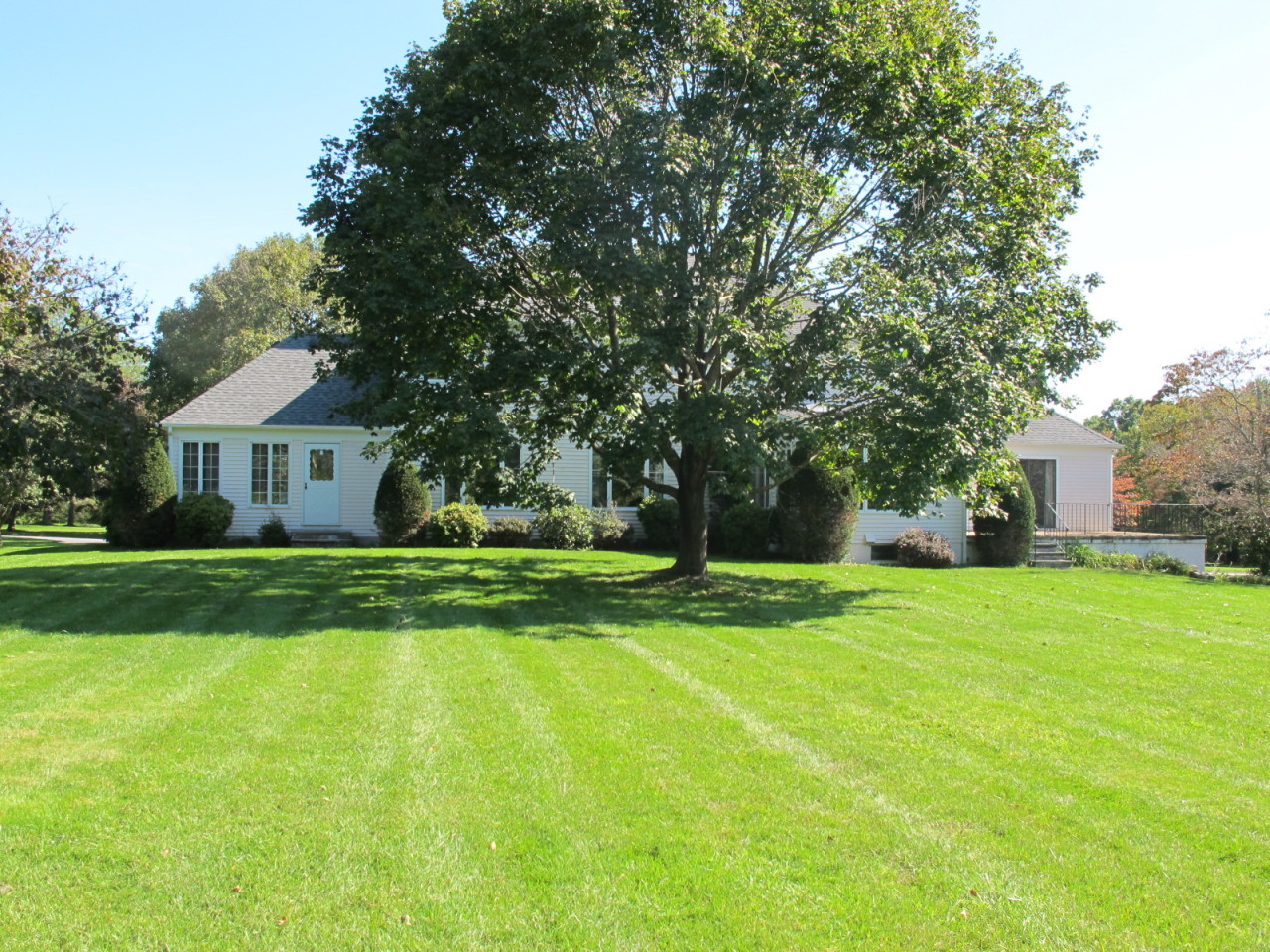 127 Middle Ridge Road New Canaan, CT 06840 - Photo 7 of 9 a front view of a house with yard and green space
