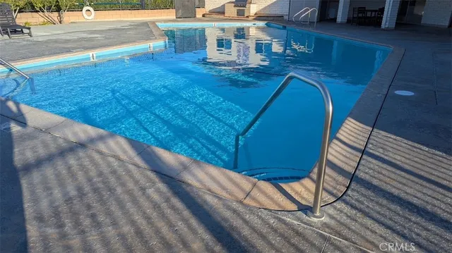 a view of a balcony with chair and wooden floor
