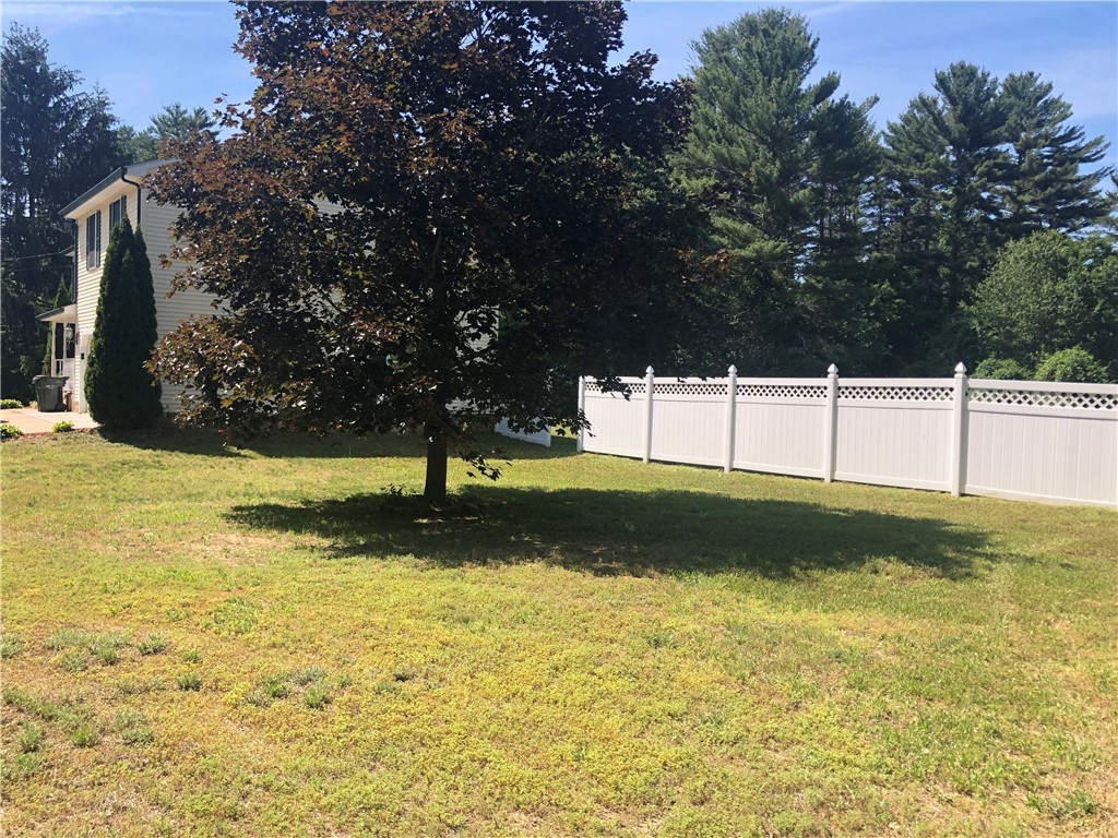 17 Pawcatuck View Road Richmond, RI 02812 - Photo 18 of 21 right side of home, maintenance free vinyl fencing