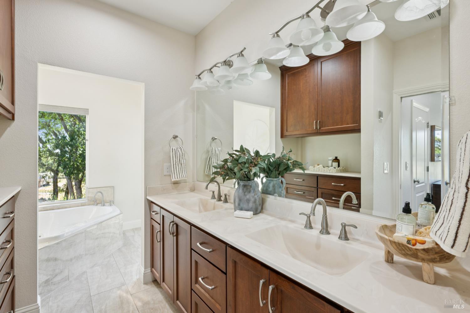 4665 Upper Ridge Road Santa Rosa, CA 95404 - Photo 33 of 71 a bathroom with a sink double vanity granite and a mirror