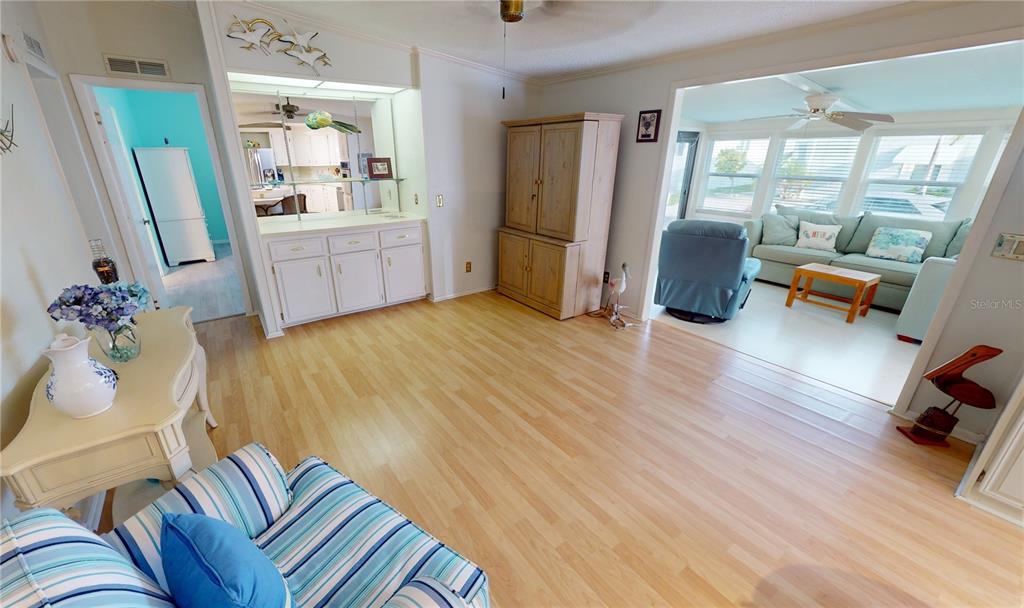 15550 Burnt Store Road, Unit 164 Punta Gorda, FL 33955 - Photo 14 of 44 a living room with furniture and a wooden floor