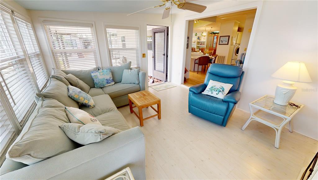 15550 Burnt Store Road, Unit 164 Punta Gorda, FL 33955 - Photo 17 of 44 a living room with furniture and a large window