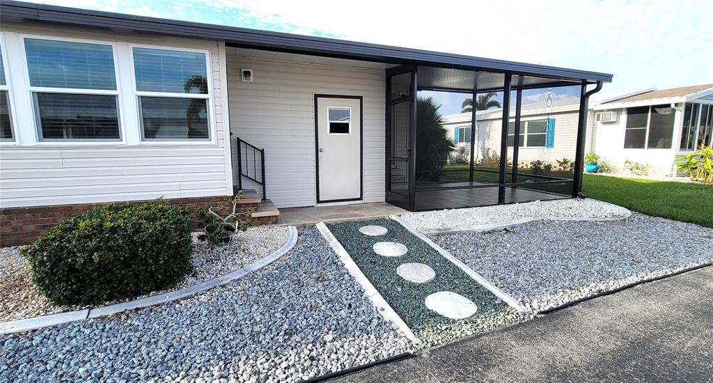 15550 Burnt Store Road, Unit 164 Punta Gorda, FL 33955 - Photo 29 of 44 front view of a house with a porch