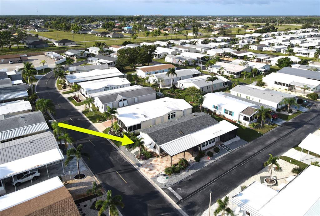 15550 Burnt Store Road, Unit 164 Punta Gorda, FL 33955 - Photo 36 of 44 an aerial view of a swimming pool with outdoor seating
