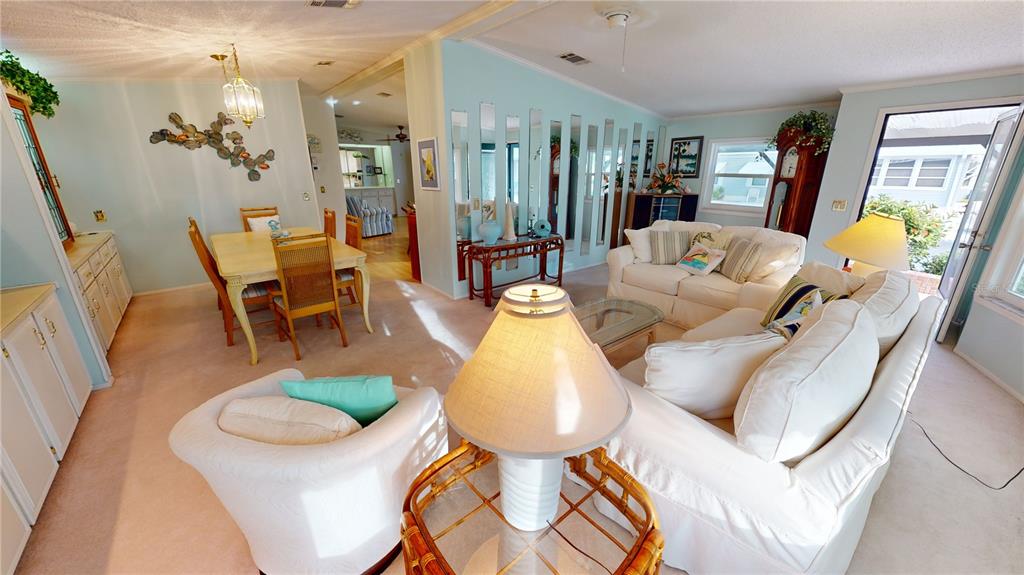 15550 Burnt Store Road, Unit 164 Punta Gorda, FL 33955 - Photo 8 of 44 a living room with furniture and wooden floor