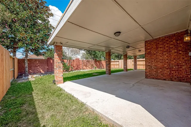 a view of a yard with garage