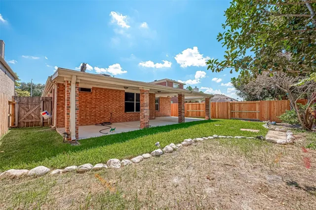 a view of a house with a back yard