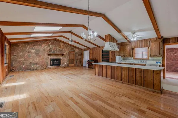 a view of kitchen with cabinets and wooden floor