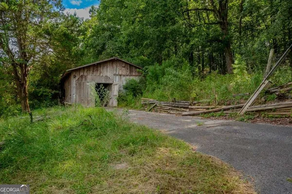 a view of backyard with green space