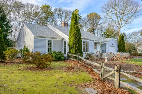 a view of a lake with houses in the back