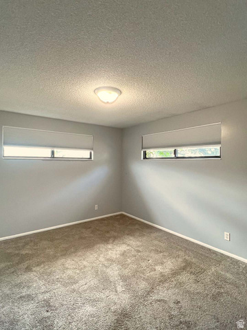 3138 Jean Street Magna, UT 84044 - Photo 16 of 26 Carpeted room with a textured ceiling and a central dome light fixture