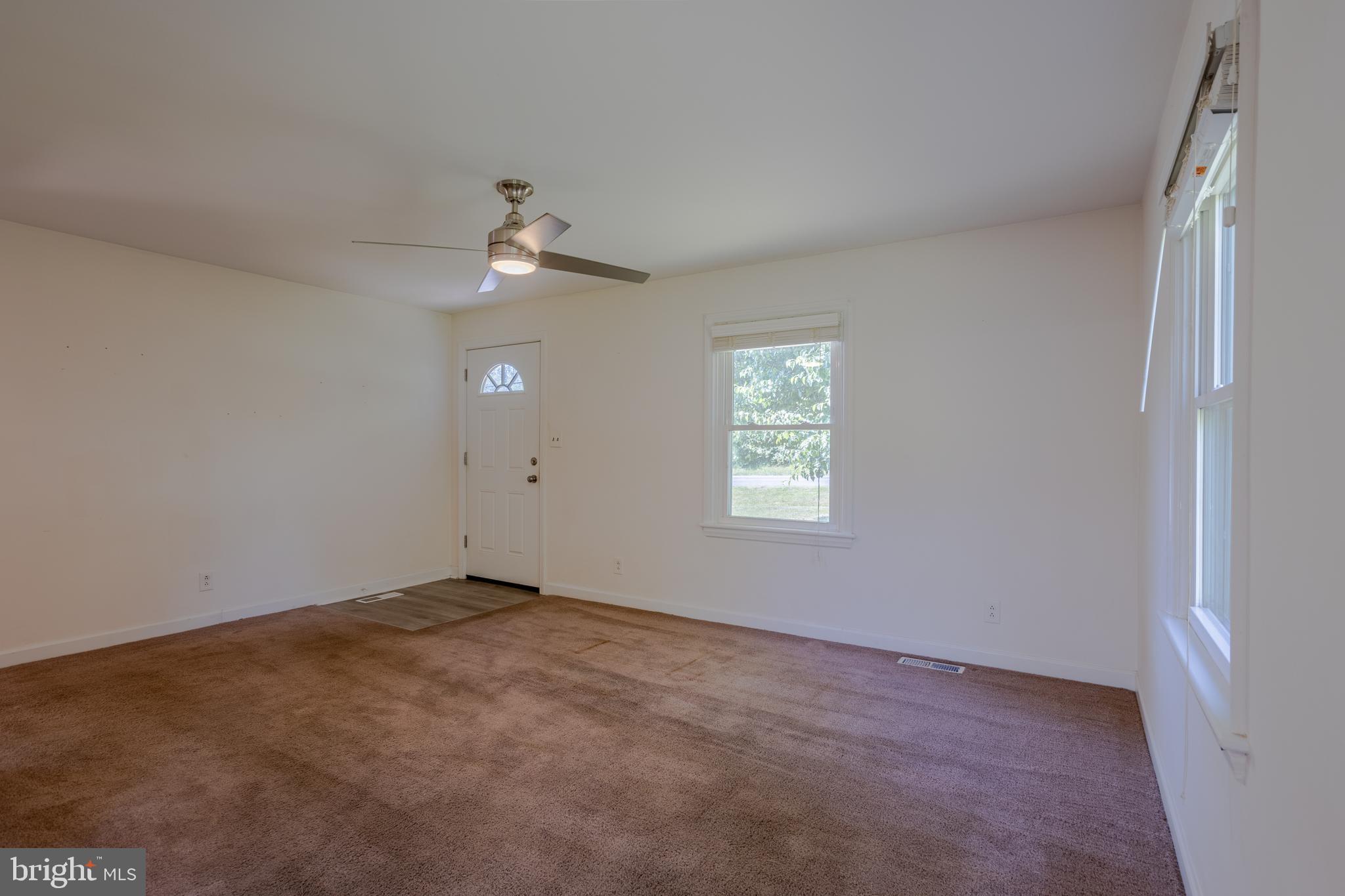 3612 Churchville Road Aberdeen, MD 21001 - Photo 4 of 49 an empty room with a window and a ceiling fan