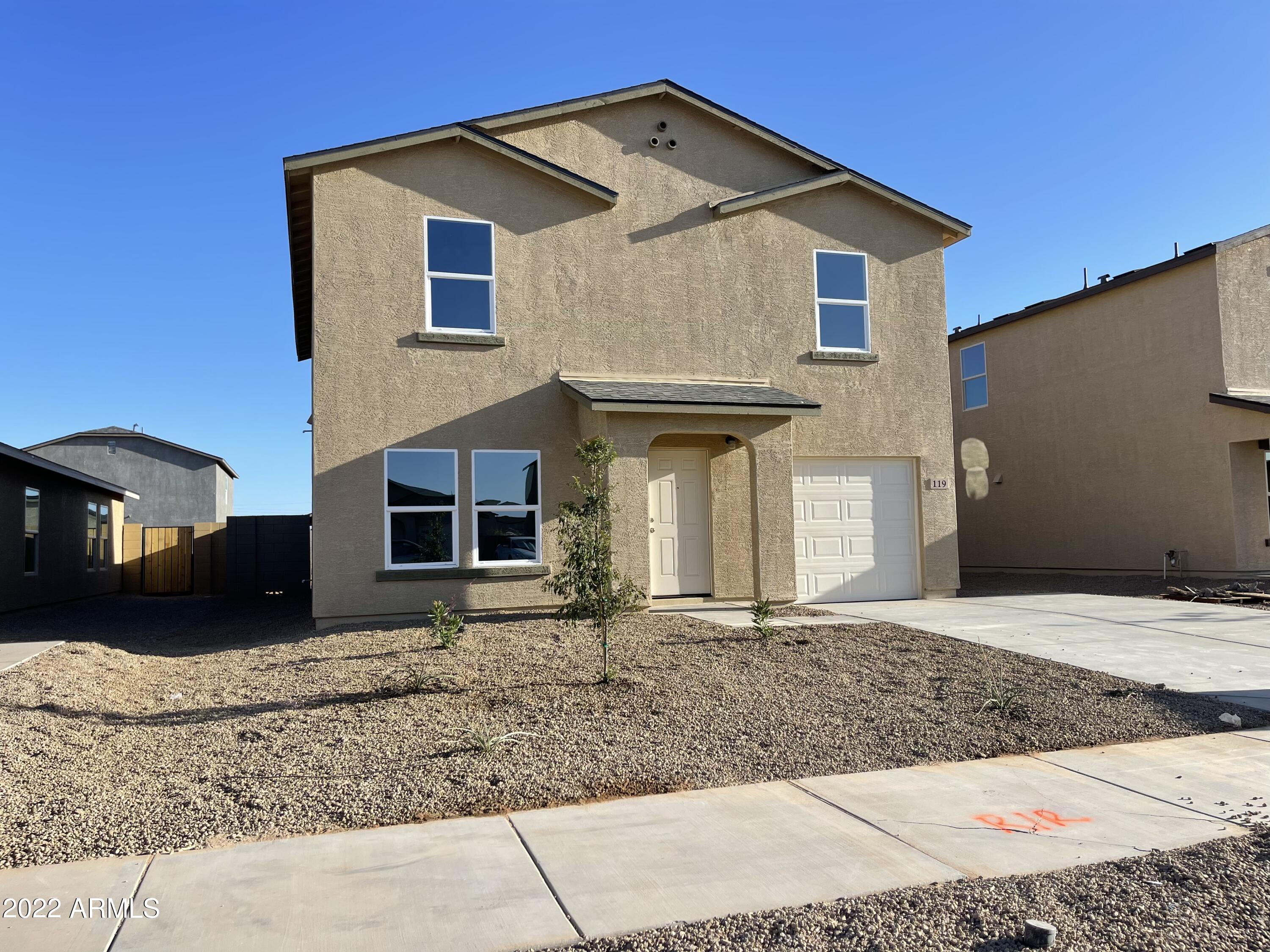 a front view of a house with a yard