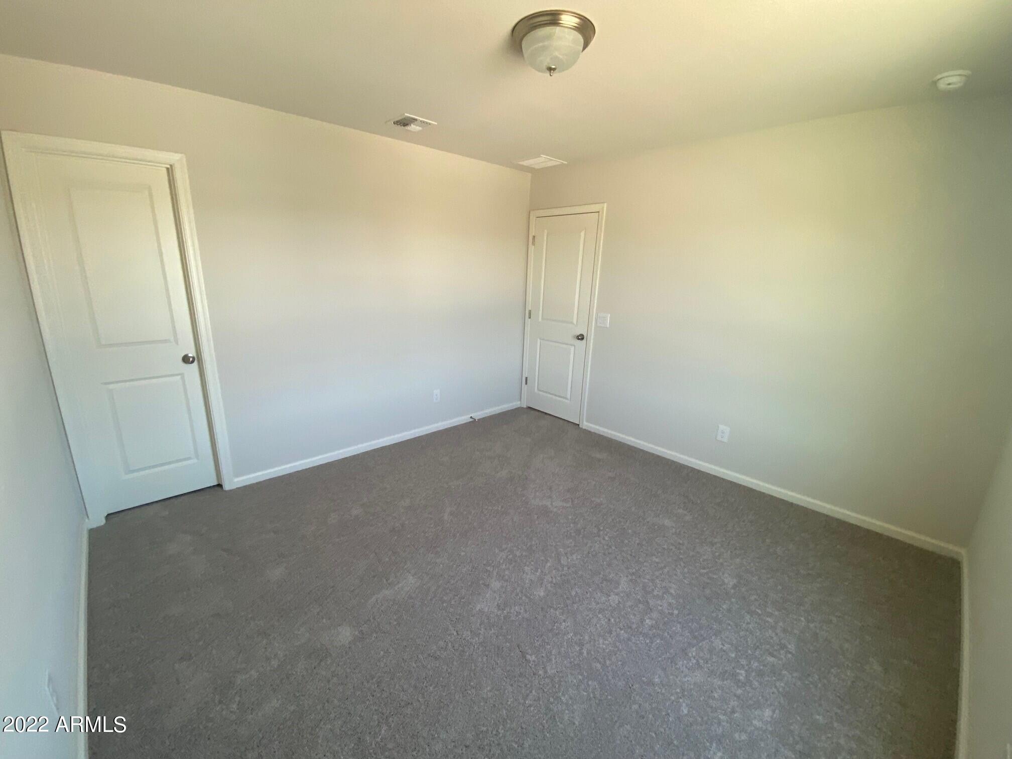 119 Dewey Avenue Coolidge, AZ 85128 - Photo 14 of 15 an empty room with a door