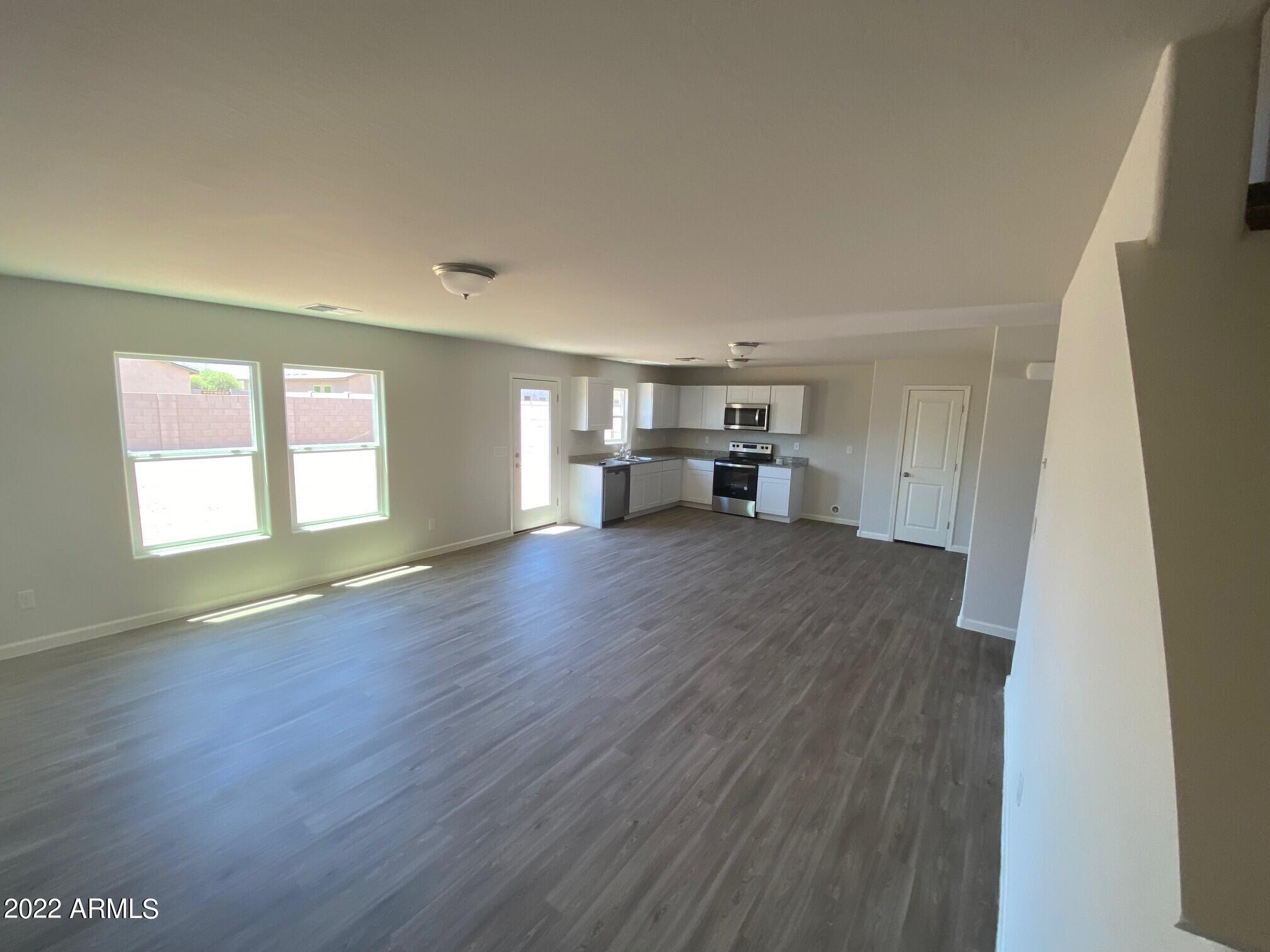 119 Dewey Avenue Coolidge, AZ 85128 - Photo 4 of 15 a view of empty room with kitchen and window