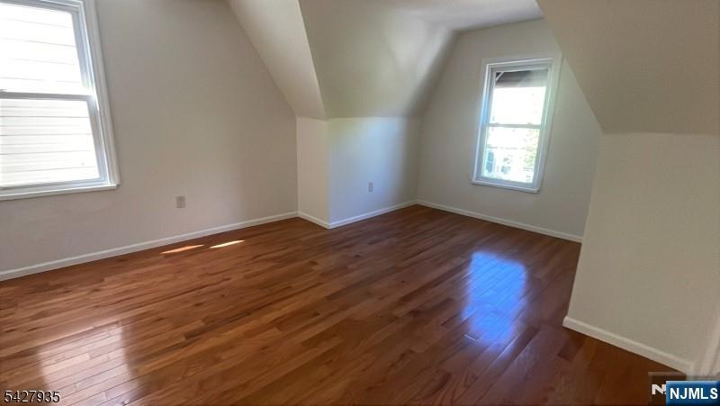 120 South 7th Street, Unit 3 Newark, NJ 07107 - Photo 4 of 5 an empty room with wooden floor and windows