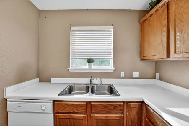 a bathroom with a sink and a window