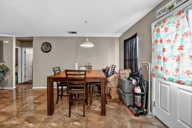 a view of a dining room with furniture