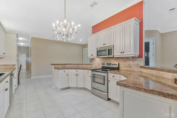 a kitchen with a sink cabinets and window