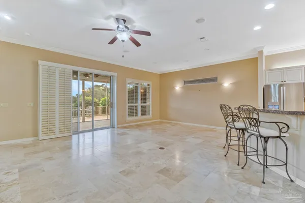 a view of empty room with a ceiling fan