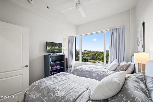 a bedroom with a bed and dresser