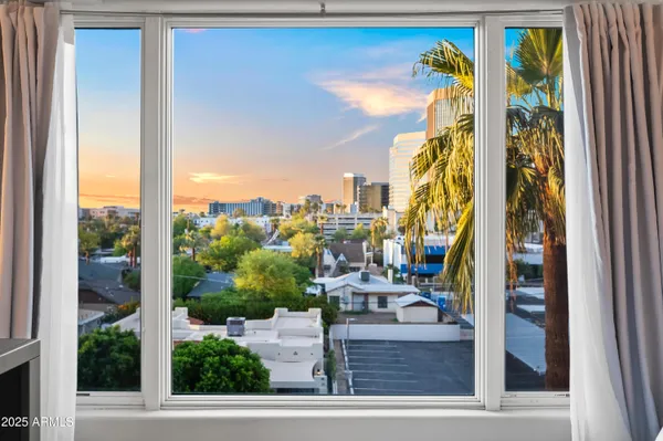 a bedroom with a bed and dresser